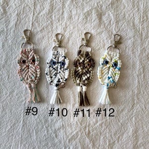 May include: Four handmade macrame owl keychains with metal clasps. Each owl has a unique color scheme, including pink, white, brown, and cream. The keychains are labeled with the numbers #9, #10, #11, and #12.