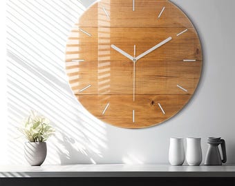 May include: A circular wall clock featuring a light brown wood grain pattern on the face, protected by a glossy glass cover. The clock has thin white hour markers and simple white hour, minute, and second hands centered on the dial.