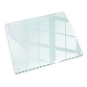 May include: A clear glass chopping board with rounded edges and a smooth surface. The board has four small silver dots on the edges.