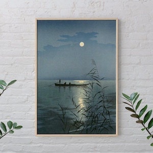 May include: A vintage Japanese woodblock print depicting a serene moonlit scene. Silhouettes of people in a boat row across a calm lake, with tall reeds in the foreground and a full moon in the sky.