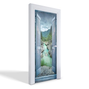 May include: A white door with blue shutters opens to reveal a view of a river flowing through a lush green valley.