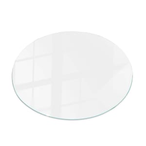 May include: A clear, round glass tabletop with a polished edge. The glass reflects light, creating bright highlights and shadows. The tabletop is a simple, modern design, suitable for various furniture styles.
