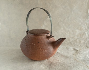 Raw clay teapot