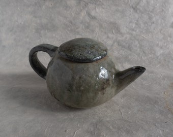 Carbon trap celadon teapot