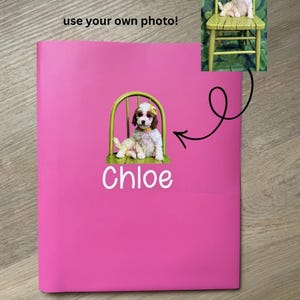 May include: A bright pink binder featuring a custom graphic of a small white and brown puppy sitting on a green chair, with the name Chloe printed in white below the image and the text use your own photo! visible at the top of the binder cover.