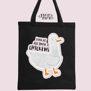 May include: Black tote bag with a white duck illustration and the text "Look at all those chickens".