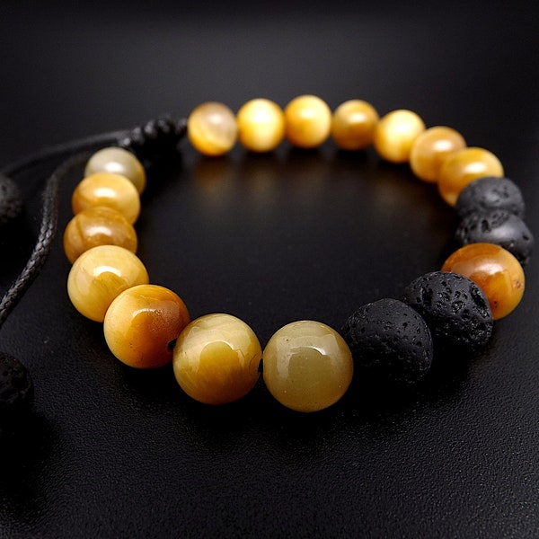Bracelet homme ou femme ,perles Œil de Tigre couleur caramel et perles de Lave sur cordon noir réglable très tendance.