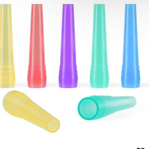 May include: A set of seven translucent, tapered plastic nozzles in yellow, red, purple, teal, and blue. Five nozzles stand vertically in a row, while one yellow and one teal nozzle are positioned horizontally in front, showing their hollow openings.