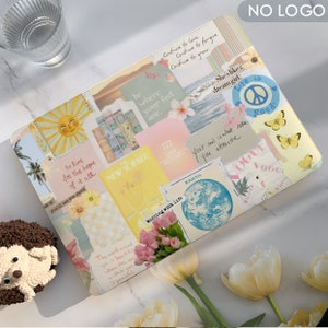 May include: A laptop with a colorful collage of stickers and images. The stickers include text like "to live for the hope of it all", "busting with life", "your soul is what makes you attractive", and "life is good".
