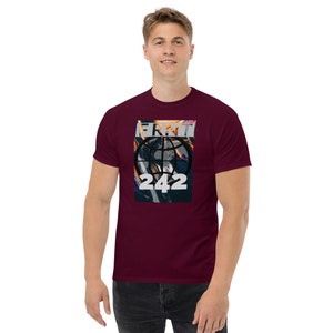 May include: A maroon t-shirt featuring a graphic print of a globe with the text "ERMT 242" on it.