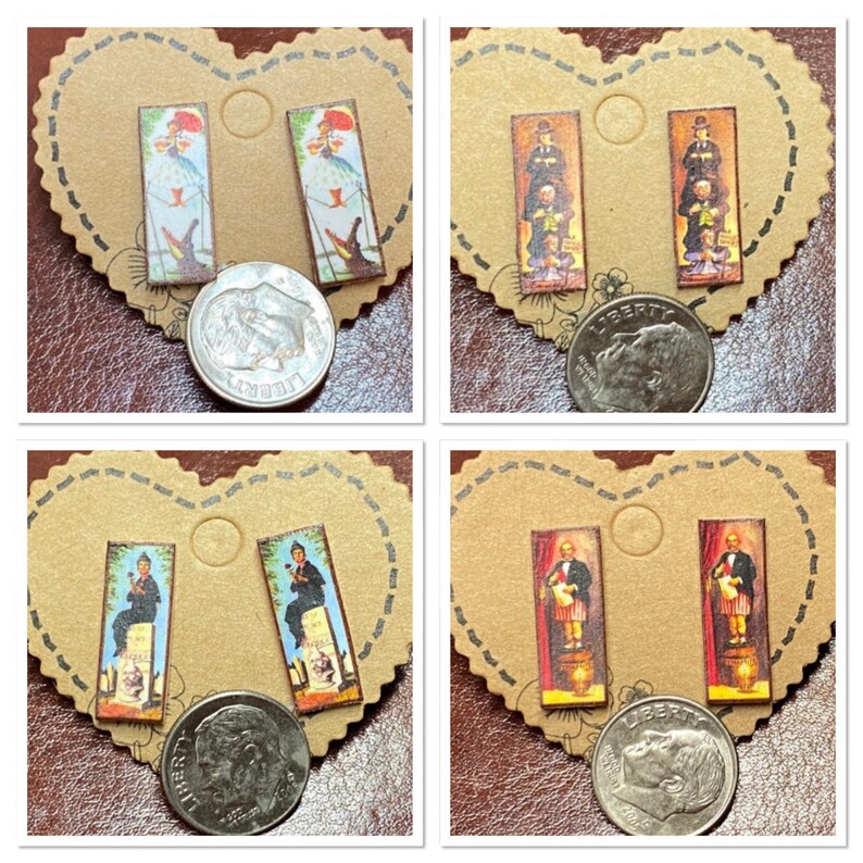 May include: Four pairs of rectangular stud earrings with different vintage-style illustrations. The earrings are on brown heart-shaped cards. The illustrations include figures with umbrellas, a man with a top hat, and a man in a suit.