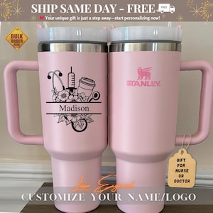 Close-up of a personalized 40oz powder-coated tumbler with a handle and straw. The laser engraving features a custom name in elegant script, a heart-shaped stethoscope design, and motivational nurse affirmations. The tumbler is shown in a professional setting, highlighting its durable finish and large capacity. Perfect gift for nurses and medical staff