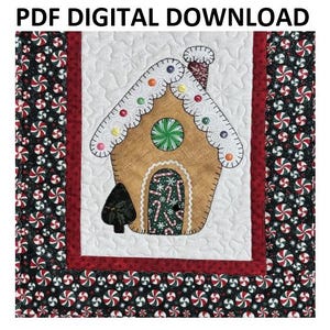 May include: A digital download PDF pattern for a quilted gingerbread house with candy details. The house is surrounded by a red and white border with a black and white candy cane print.