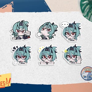 May include: A set of six die-cut stickers featuring an anime-style character with teal hair, glasses, and a black headband. The character displays various expressions including determination, confusion, and excitement. A small circular logo reads ROBU.