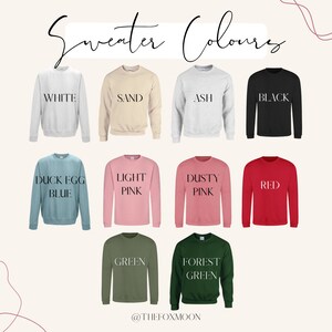 May include: A collection of ten crew neck sweatshirts in various colors, including white, sand, ash, black, duck egg blue, light pink, dusty pink, red, green, and forest green. The text "Sweater Colours" is at the top of the image. The text "@THEFOXMOON" is at the bottom of the image.