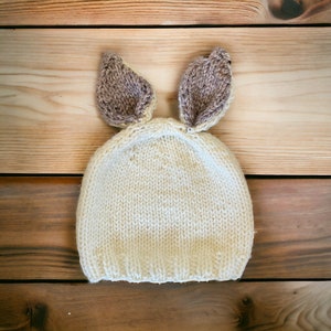 Hand knitted bunny ears hat for babies. Easter baby hat knitted with bunny ears.
