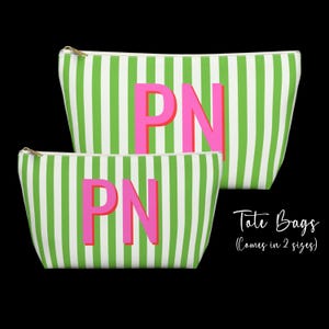 May include: Two zippered pouches featuring a vertical lime green and white striped pattern. Each pouch displays the pink letters PN centered on the front. The text Tote Bags (Comes in 2 sizes) is visible in the lower right corner of the image.