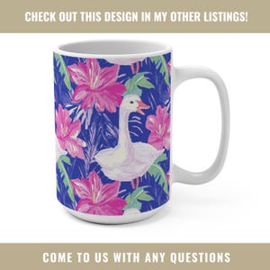 May include: White ceramic mug featuring a vibrant design of a white goose, pink flowers, and green leaves against a deep blue background. The mug has a white handle and the text "CHECK OUT THIS DESIGN IN MY OTHER LISTINGS!" and "COME TO US WITH ANY QUESTIONS".