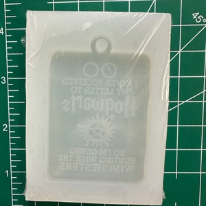May include: A clear, rectangular silicone mold for crafting keychains. The mold features text and symbols from the Harry Potter and Supernatural franchises. The text includes "Hogwarts", "I never received my letter to Hogwarts", and "So I'm going hunting with the Winchesters".