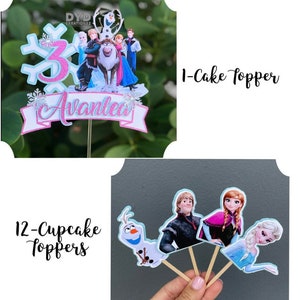 May include: Frozen themed cake topper set with a large cake topper featuring Olaf, Kristoff, Anna, Elsa, and Sven. The cake topper also includes a snowflake and the number 3. The set also includes 12 cupcake toppers featuring Olaf, Kristoff, Anna, and Elsa.