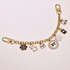 Economical ExcellenceCHANEL, Other, 3 Mystery Designer Crocs Charms, coco chanel  croc charms