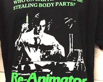 May include: Black t-shirt with a green graphic of a man in a lab coat holding a syringe. The text "WHO ON EARTH WOULD BE STEALING BODY PARTS?" is above the graphic. The text "H.P. Lovecraft's Re-Animator" is below the graphic.