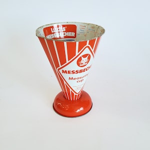 Bright red, antique measuring jug: Luchs kitchen measure for barley, lentils, sugar, and salt. Brocante decoration for the shabby chic country kitchen.