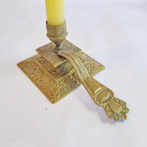 Old candlestick richly decorated, with handle, ornate brass candlestick, flat vintage candlestick, Art Nouveau, Victoria