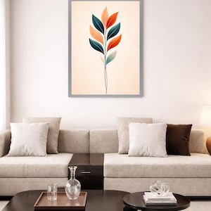 May include: A framed wall art print featuring a vertical botanical illustration of a single stem with symmetrical leaves in shades of dark teal, muted orange, and soft peach, set against a light cream background within a thin gray frame.