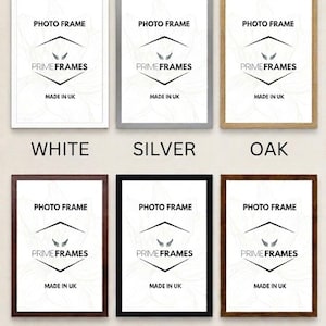 May include: Six rectangular photo frames in white, silver, oak, dark oak, black, and walnut finishes. Each frame contains a white insert with the text PHOTO FRAME, PRIME FRAMES, and MADE IN UK, featuring a central graphic of two small wings.
