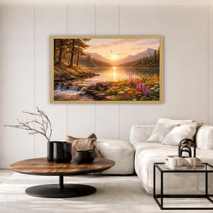 May include: A rectangular landscape painting in a light wood frame depicting a sunset over a mountain lake. The scene features a flowing stream, pine trees, and colorful wildflowers in shades of orange, yellow, and purple under a golden sky.