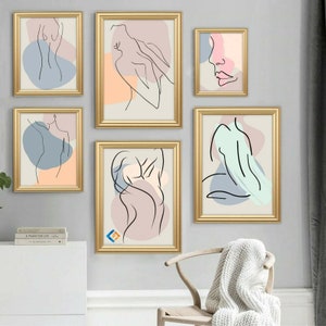 May include: Set of six gold framed abstract line art prints featuring nude figures in various poses. The prints are on a light grey background with pastel coloured shapes.