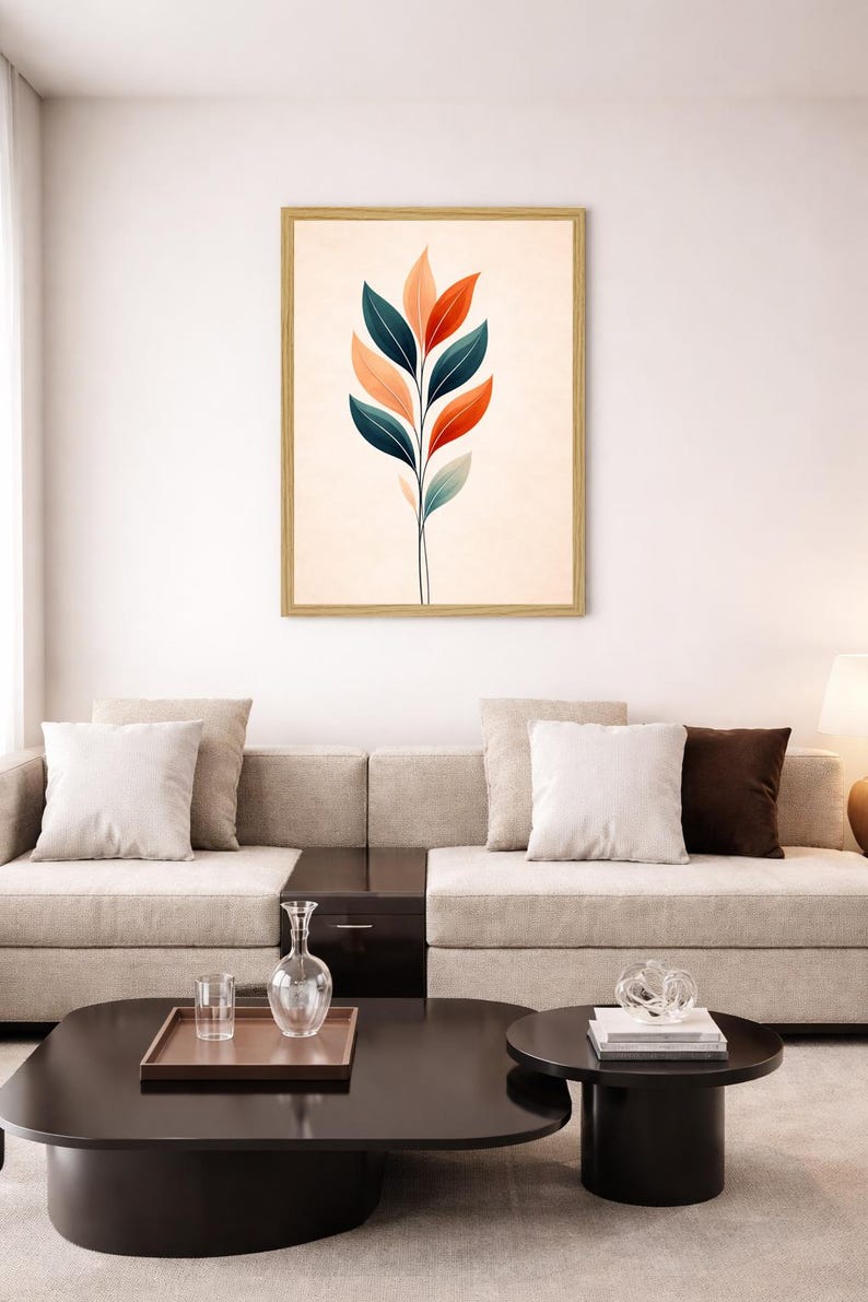 May include: A framed wall art print featuring a vertical botanical illustration of a single stem with alternating leaves in shades of deep teal, soft peach, and muted orange, set against a solid, light cream-colored background within a light wood frame.