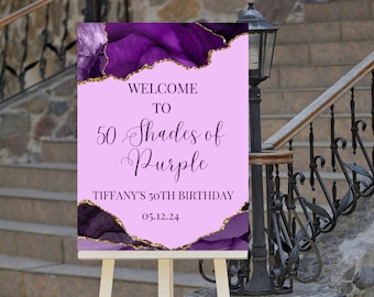 May include: Welcome to 50 Shades of Purple, Tiffany's 50th Birthday, 05.12.24. A purple and gold agate design with glitter accents on a pink background.