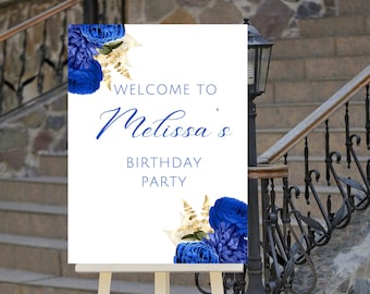 May include: Welcome to Melissa's Birthday Party sign with blue and gold floral accents on a white background. The sign is displayed on a wooden easel.