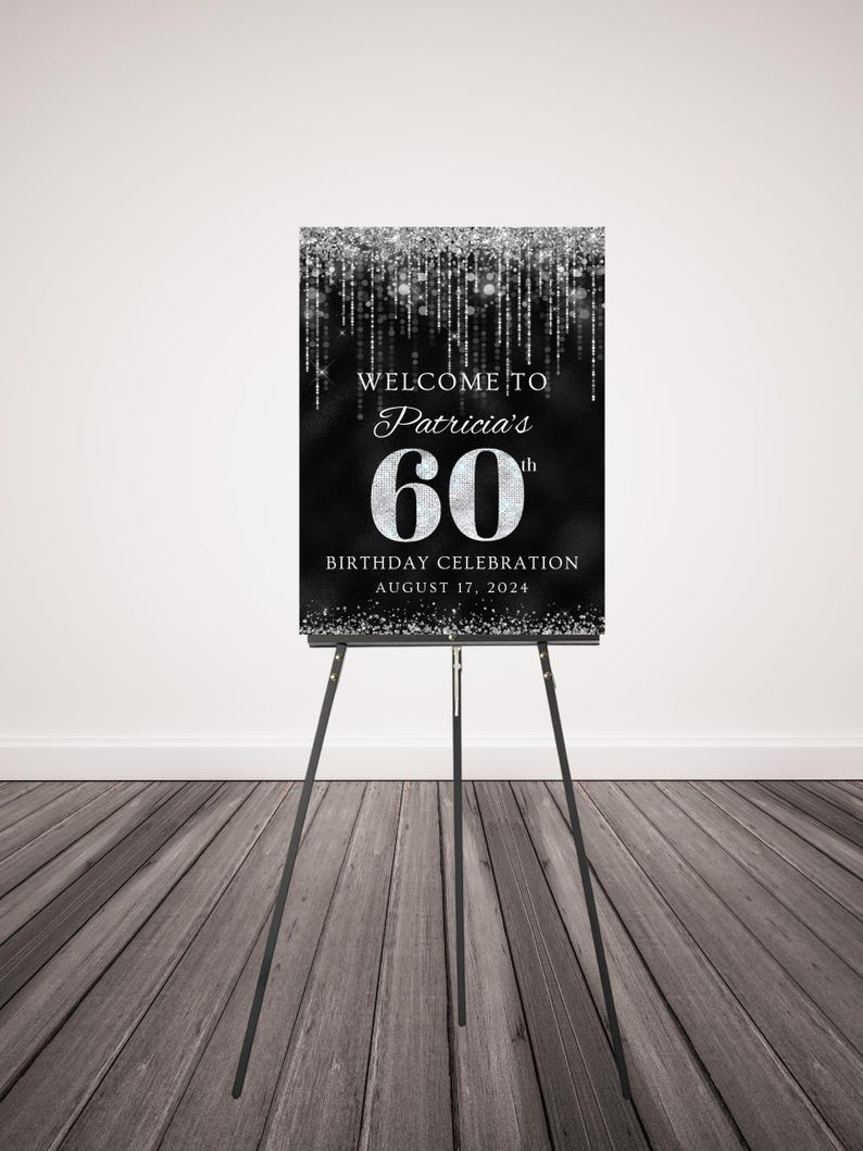 May include: A black and silver welcome sign with glitter accents. The sign reads "Welcome to Patricia's 60th Birthday Celebration August 17, 2024".