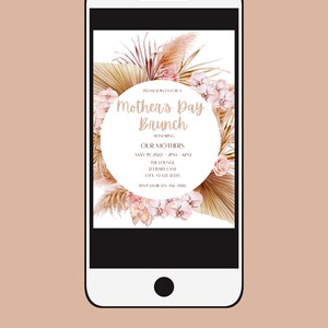 May include: A digital invitation for a Mother's Day brunch. The invitation features a floral design with pink orchids and pampas grass. The text reads "Please join us for a Mother's Day Brunch honoring our mothers, May 19, 2022, 2pm-6pm, The Lounge, 23 Baby Lane, City, State 12345, RSVP: Jan 123-456-7880."