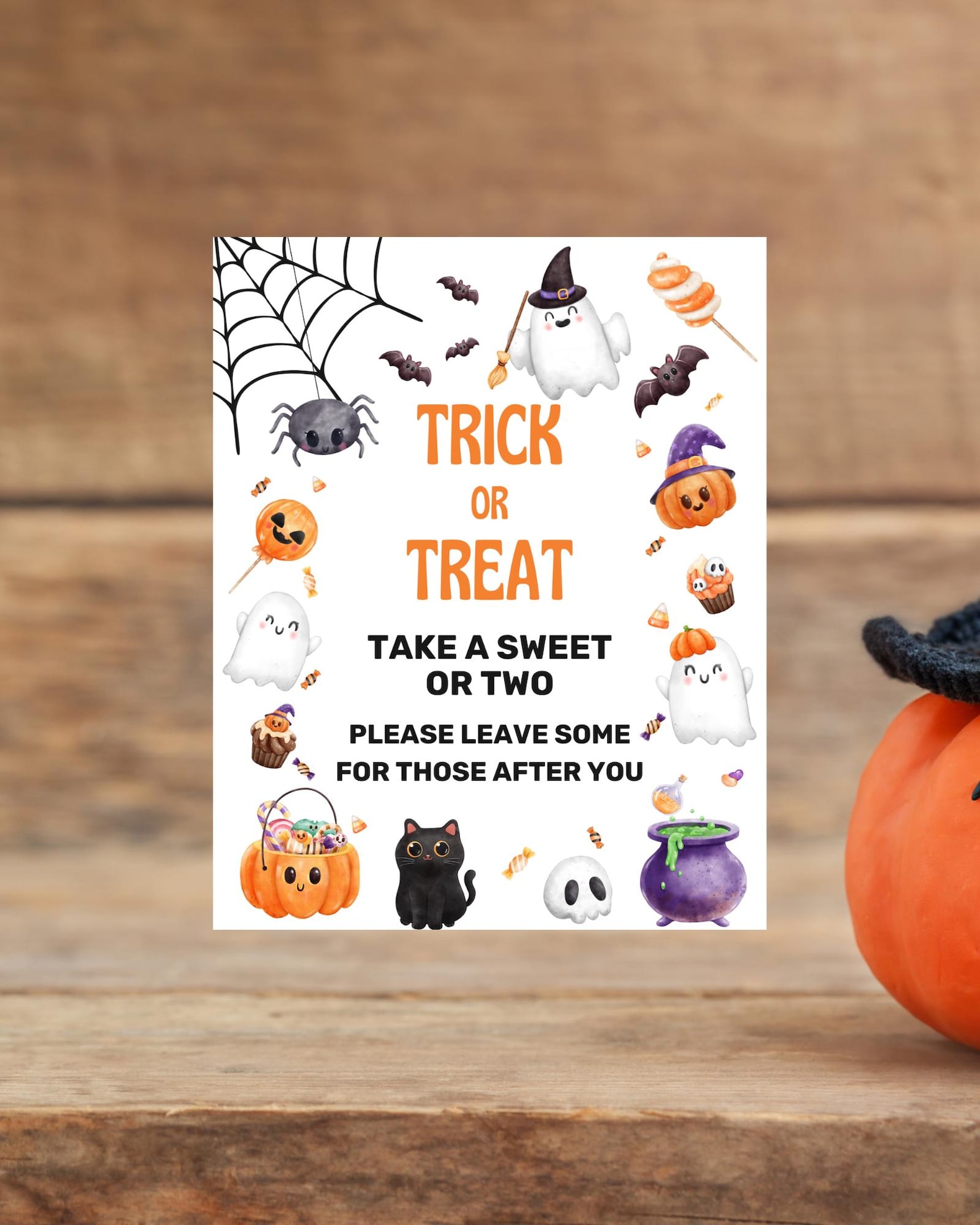 A Polite Leave-Some-for-Others Reminder Halloween candy sign with witch hat, sweets and a leave-some-for-others message.