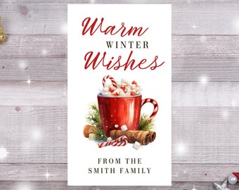 May include: A white card with red text that says "Warm Winter Wishes" and a red mug with marshmallows and candy canes. The card also says "From the Smith Family".