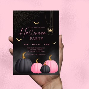 May include: Black and pink Halloween party invitation with a spider web, bats, and pumpkins. The text reads "Please join us for a Halloween Party, Sat | Oct 17 | 8 PM, The Smith's Residence, 123 Scary Avenue, Houston, Texas 12345, Costumes Encouraged."