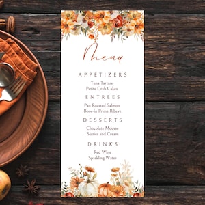 May include: A fall-themed menu with a watercolor illustration of pumpkins and flowers. The menu lists appetizers, entrees, desserts, and drinks. The text reads: "Theny", "Appetizers", "Tuna Tartare", "Petite Crab Cakes", "Entrees", "Pan Roasted Salmon", "Bone-in Prime Ribeye", "Desserts", "Chocolate Mousse", "Berries and Cream", "Drinks", "Red Wine", "Sparkling Water".