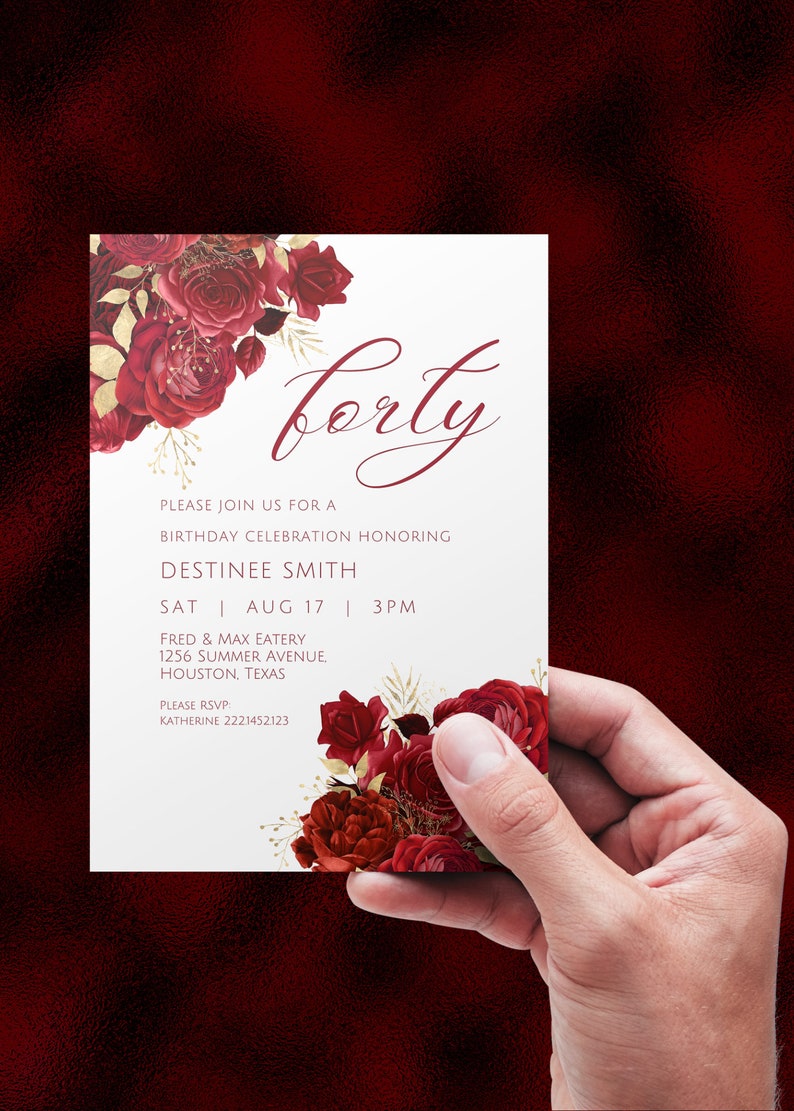 May include: A white invitation card with a red floral design and gold accents. The text on the card reads "forty" and includes details for a birthday celebration honoring Destinee Smith. The event is scheduled for Saturday, August 17th at 3 PM at Fred & Max Eatery, 1256 Summer Avenue, Houston, Texas. The RSVP information is provided with a phone number.
