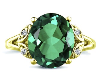 Oval cut Lab-Created Emerald big gemstone engagement wedding ring in 14K yellow gold.
