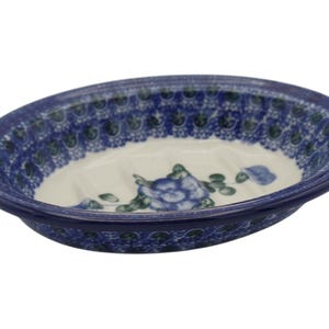 May include: Oval ceramic soap dish with a blue floral design. The dish features a white interior with a blue flower and green leaves. The rim is a darker blue with a repeating pattern. A decorative bathroom accessory.