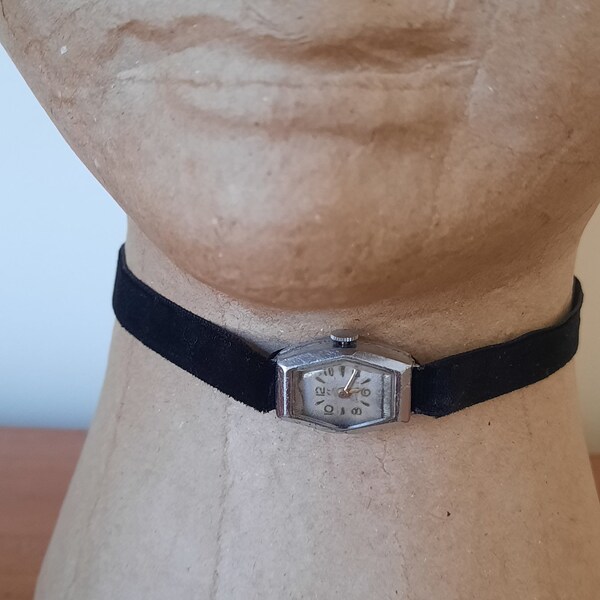 Silver mid century authentic diamond shaped watch choker with slim black velvet band, which can be tied at back.