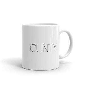 May include: White ceramic coffee mug with the word "CUNTY" printed in black.