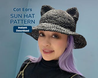 May include: A black sun hat with cat ears. The hat has a wide brim and is made of a woven material. The text "Cat Ears SUN HAT PATTERN" is displayed on the image, along with "Instant Download".
