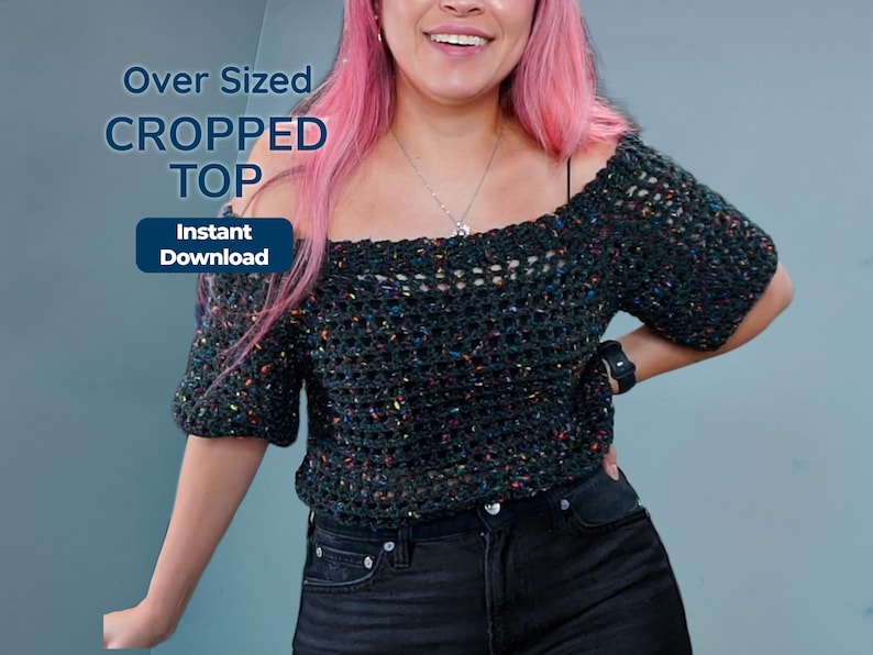 A person with pink hair wears an off-the-shoulder dark speckled crochet top and black jeans, with overlaid text reading Over Sized Cropped Top and Instant Download.