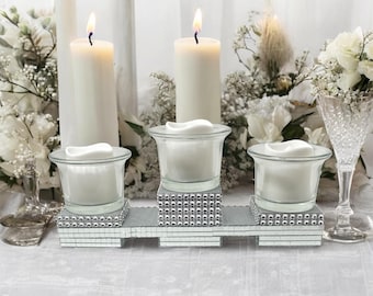 A Pair of Duchin Creation Sterling Silver Weighted Candleholders