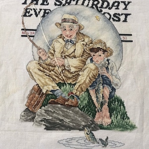Ready to frame finished cross stitch “Catching the Big One” Norman Rockwell, Saturday Evening Post, Aug 3 1929